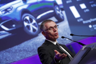 PSA Peugeot Citroen Chief Executive Carlos Tavares delivers his speech during the presentation of the company's 2016 full year results, in Paris, Thursday, Feb.23, 2017. (AP Photo/Christophe Ena)