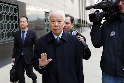 Takata Corp.'s chief financial officer Yoichiro Nomura leaves federal court in Detroit, Monday, Feb. 27, 2017. Japanese auto parts maker Takata Corp. pleaded guilty to fraud Monday and agreed to pay $1 billion in penalties for concealing an air bag defect blamed for at least 16 deaths, most of them in the U.S. (AP Photo/Paul Sancya)