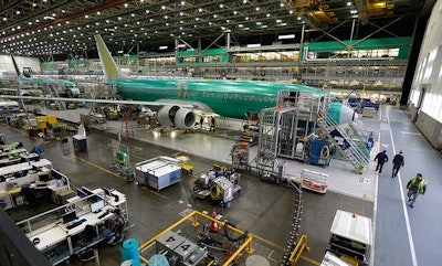In this Tuesday, Dec. 16, 2014, file photo, Boeing 737-800 airplanes are on the assembly line at Boeing's 737 assembly facility in Renton, Wash. On Friday, Feb. 3, 2017, the Commerce Department reports on U.S. factory orders for December. (AP Photo/Ted S. Warren, File)