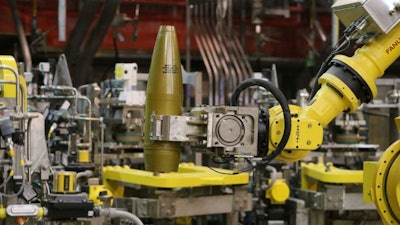 Robots are remotely controlled to to handle inert simulated chemical munitions used for training at the Pueblo Chemical Depot, east of Pueblo, in southern Colorado. (AP Photo)