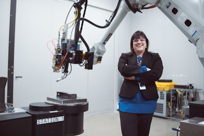 GE's Jennifer Cipolla in a laser-cladding cell. This technology is using a 6-kilowatt laser to repair machine parts. (Images credit: Mark Trent for GE Reports)