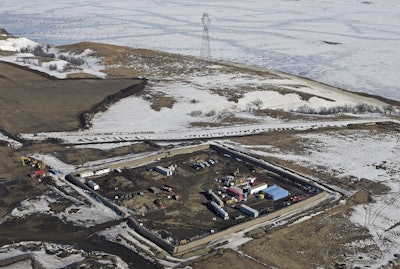 In this Feb. 13, 2017, aerial file photo shows the site where the final phase of the Dakota Access Pipeline will take place with boring equipment routing the pipeline underground and across Lake Oahe to connect with the existing pipeline in Emmons County near Cannon Ball, N.D. (Tom Stromme/The Bismarck Tribune via AP, File)