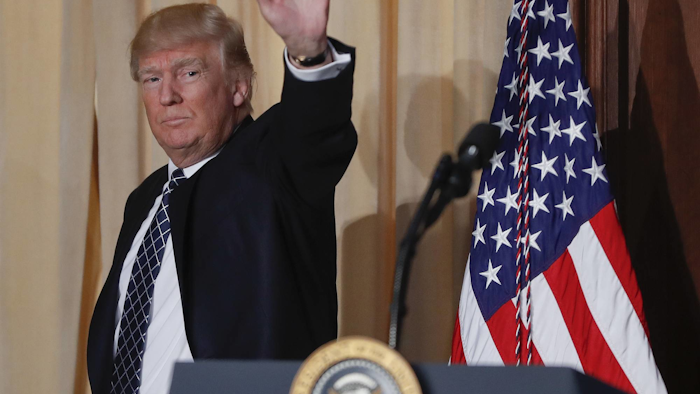 President Donald Trump waves as he walks off stage after signing an Energy Independence Executive Order, Tuesday, March 28, 2017, at EPA headquarters in Washington, Tuesday, March 28, 2017. (AP Photo/Pablo Martinez Monsivais)