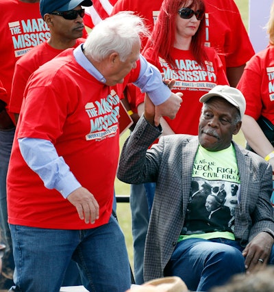 UAW president Dennis Williams, left, is congratulated on his comments by actor Danny Glover at a pro-union rally near Nissan Motor Co.'s Canton, Miss., plant, Saturday, March 4, 2017. Participants marched to the plant to deliver a letter to the company demanding the right to vote on union representation to address better wages, safe working conditions and job security. (AP Photo/Rogelio V. Solis)