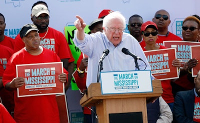 U.S. Sen. Bernie Sanders, I-Vt, tells thousands at a pro-union rally near Nissan Motor Co.'s Canton, Miss., plant, Saturday, March 4, 2017, that he congratulates workers for their courage 'in standing up for justice.' Among the participants were actor Danny Glover, national NAACP President Cornell Brooks, U.S. Rep. Bennie Thompson, D-Miss., and UAW president Dennis Williams. (AP Photo/Rogelio V. Solis)