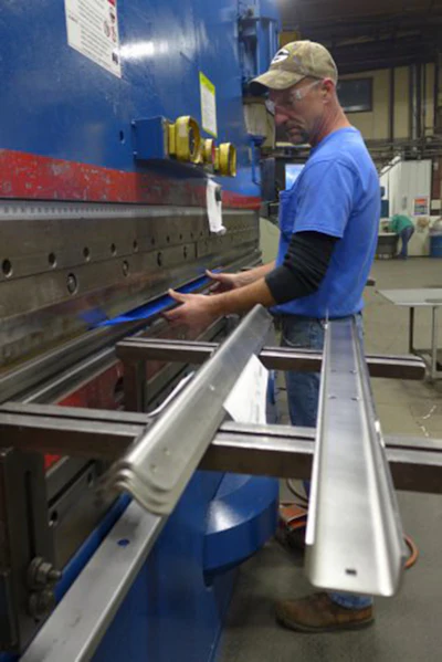 A worker bends conveyor supports at Nercon’s factory in Oconto. Nercon has streamlined its operations and shortened after its leaders attended the UW’s Lean Operations Management Certificate program. Photo: David Tenenbaum