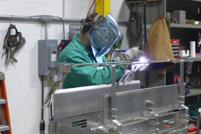 A welder assembles a stainless steel sub-assembly at Nercon. Use of sub-assemblies has streamlined operations and reduced the need for building space. Photo: David Tenenbaum