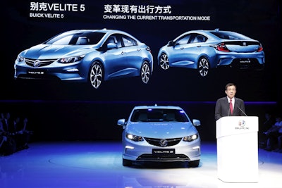 GM president Wang Yongping announces the global launch of the Buick Velite 5, an extended range electric hybrid, during a global launch event ahead of the Shanghai Auto 2017 show in Shanghai, China, Tuesday, April 18, 2017. At the auto show, the global industry's biggest marketing event of the year, almost every global and Chinese auto brand is showing at least one electric concept vehicle, if not a market-ready model. (AP Photo/Ng Han Guan)