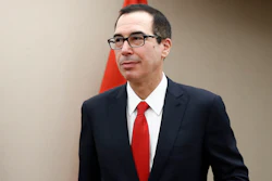 Treasury Secretary Steven Mnuchin arrives for a meeting, Friday, April 21, 2017, at the 2017 World Bank Group Spring Meetings in Washington. Mnuchin said in a brief statement that the administration 'will not be issuing waivers to U.S. companies, including Exxon, authorizing drilling prohibited by current Russian sanctions.' (AP Photo/Carolyn Kaster)