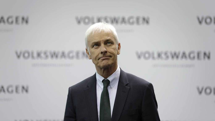 Matthias Mueller, CEO of Volkswagen, looks up as he arrives for a press conference of the German Volkswagen company in Wolfsburg, Germany. Stuttgart prosecutors say Wednesday, May 17, 2017 they’re investigating whether Mueller manipulated markets by not releasing information about VW’s diesel cheating soon enough. (AP Photo/Michael Sohn, file)