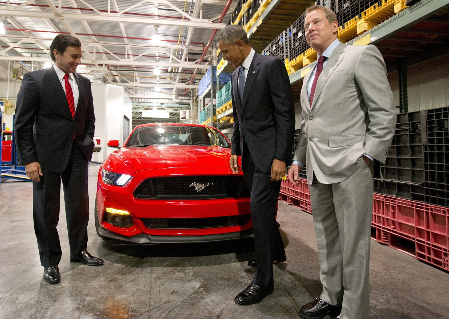 In this Jan. 7, 2015 file photo, President and CEO of Ford, Mark Fields, from left, President Barack Obama, and Bill Ford look at a new Mustang at Ford Michigan Assembly Plant in Wayne, Mich. Ford is replacing its CEO amid questions about its current performance and future strategy, a person familiar with the situation has said. Fields will be replaced by Jim Hackett, who joined Ford's board in 2013. (AP Photo/Carolyn Kaster, File)