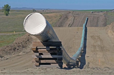 This Sept. 29, 2016, file photo, shows a section of the Dakota Access pipeline under construction near St. Anthony in Morton County, N.D. The Dakota Access pipeline system leaked about 100 gallons of oil in western North Dakota in two separate incidents in March as crews worked to get the four-state line ready for operation. They’re the second and third known leaks on the disputed $3.8 billion pipeline. (Tom Stromme/The Bismarck Tribune via AP, File)