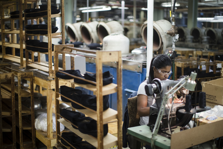 A worker takes part in the manufacturing of Kangol hats the Bollman Hat Company in Adamstown, Pa., Monday, May 1, 2017. U.S. apparel production has increased 50 percent since 2009, according to the American Apparel & Footwear Association, as some footwear and clothing makers decided to accept higher labor costs in exchange for greater inventory control and proximity to U.S. customers. (AP Photo/Matt Rourke)