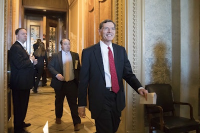 Sen. John Barrasso, R-Wyo., chairman of the Senate Environment and Public Works Committee, leaves the chamber following a surprising win for environmentalists and Democrats and a blow to the fossil-fuel industry, as the Republican-led Senate failed in a bid to reverse an Obama-era regulation restricting harmful methane emissions that escape from oil and gas wells on federal land, at the Capitol in Washington, Wednesday, May 10, 2017. (AP Photo/J. Scott Applewhite)