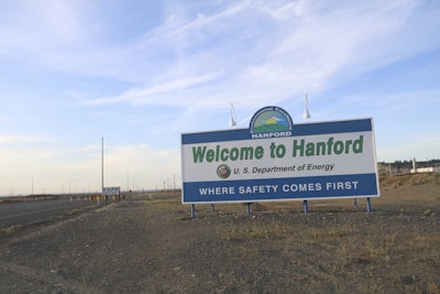 A sign welcomes drivers to Hanford Nuclear Reservation in Benton County Tuesday, May 9, 2017, in Richland, Wash. A portion of an underground tunnel containing rail cars filled with radioactive waste collapsed at a sprawling storage facility in a remote area of Washington state, forcing an evacuation of some workers at the site that made plutonium for nuclear weapons for decades after World War II. (AP Photo/Manuel Valdes)