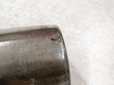 Counterfeit bearing used for less than 40 hours.