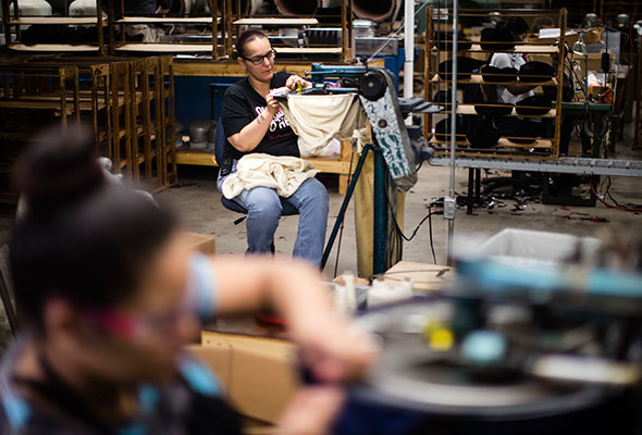 A worker takes part in the manufacturing of Kangol hats the Bollman Hat Company in Adamstown, Pa., Monday, May 1, 2017. U.S. apparel production has increased 50 percent since 2009, according to the American Apparel & Footwear Association, as some footwear and clothing makers decided to accept higher labor costs in exchange for greater inventory control and proximity to U.S. customers. (AP Photo/Matt Rourke)