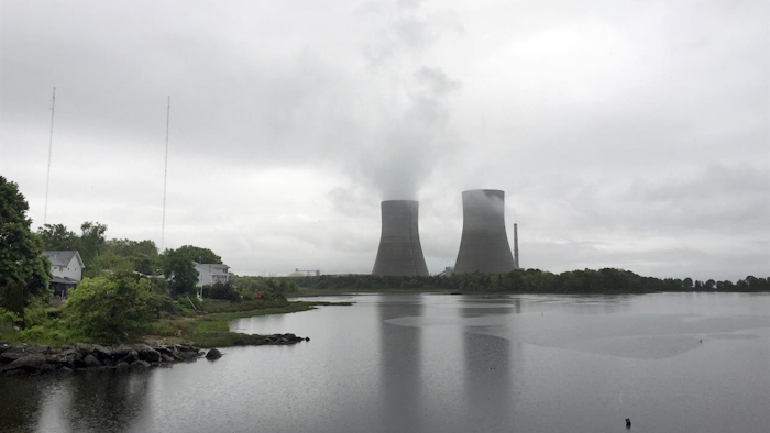 The Brayton Point Power Station, New England's largest and one of its last coal-fired power plants, appears on a cloudy day, Wednesday, May 31, 2017, in Somerset, Mass. The plant, which has been generating electricity since the 1960s along Mount Hope Bay, is shutting down permanently. It's been cited by federal regulators as one of the region's heaviest polluters. (AP Photo/Matt O'Brien)