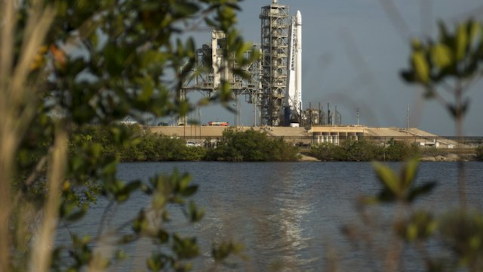 The SpaceX Falcon 9 rocket, with the Dragon spacecraft onboard, is seen shortly after being raised vertical at Launch Complex 39A at NASA's Kennedy Space Center in Cape Canaveral, Florida, Thursday, June 1, 2017. SpaceX is taking recycling to a whole new realm — all the way to orbit. On this week's supply run to the International Space Station, SpaceX will launch a Dragon capsule that's already traveled there. The milestone comes just two months after the launch of its first reused rocket booster for a satellite. (Bill Ingalls/NASA via AP)