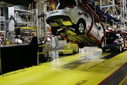 In this Monday, Jan. 28, 2013, file photo, cars move along an assembly line at the General Motors Fairfax plant in Kansas City, Kan. General Motors is extending the normal two-week summer shutdown at two U.S. car factories because of slumping demand. Union officials say the Lordstown, Ohio, plant near Cleveland and the Fairfax plant in Kansas City, Kan., will close for as long as five weeks in June and July 2017. (AP Photo/Orlin Wagner, File)