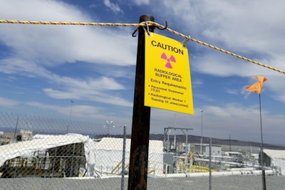 In this photo taken July 11, 2016, a sign warns of radioactive material stored underground on the Hanford Nuclear Reservation near Richland, Wash. (AP Photo/Ted S. Warren)