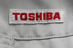 In this Thursday, June 15, 2017, photo, the logo of Toshiba Corp., Japan's electronics and energy company, is seen on a worker's jacket in Yokosuka, near Tokyo. Tokyo-based Toshiba, whose U.S. nuclear unit Westinghouse Electric Co. filed for bankruptcy protection in March, said Friday it received an extension until Aug. 10 to give its earnings report for the fiscal year that ended in March. (AP Photo/Shuji Kajiyama, File)