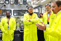 In this May 10, 2017, file photo, U.S. Secretary of Energy Rick Perry, second from left, accompanied by Laboratory Director Charlie McMillan, second from right, learns about capabilities at the Los Alamos National Laboratory's Plutonium Facility, from Jeff Yarbrough, right, Los Alamos Associate Director for Plutonium Science and Manufacturing in Los Alamos, N.M. Criticism of the safety record at one of the nation's top federal laboratories is intensifying as work at Los Alamos National Laboratory ramps up to produce a key component for the nation's nuclear weapons cache. (Los Alamos National Laboratory via AP, file)