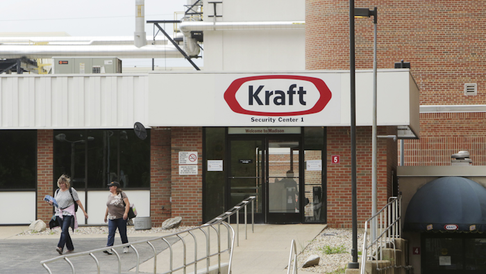 In this Wednesday, June 28, 2017 photo, workers leave after finishing their shift at Kraft Oscar Mayer headquarters and plant in Madison, Wis. The last cold cuts are rolling off the line at Oscar Mayer in Madison, ending nearly 100 years of production at the plant on Thursday. (Amber Arnold/Wisconsin State Journal via AP)