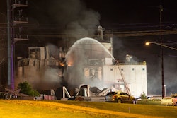 1 This Thursday, June 1, 2017, photo provided by Jeff Lange shows firefighters at the scene following an explosion and fire at the Didion Milling plant in Cambria, Wis. Recovery crews searched a mountain of debris on Thursday following a fatal explosion late Wednesday at the corn mill plant, which injured about a dozen people and leveled parts of the sprawling facility in southern Wisconsin, authorities said. (Jeff Lange via AP)
