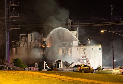1 This Thursday, June 1, 2017, photo provided by Jeff Lange shows firefighters at the scene following an explosion and fire at the Didion Milling plant in Cambria, Wis. Recovery crews searched a mountain of debris on Thursday following a fatal explosion late Wednesday at the corn mill plant, which injured about a dozen people and leveled parts of the sprawling facility in southern Wisconsin, authorities said. (Jeff Lange via AP)