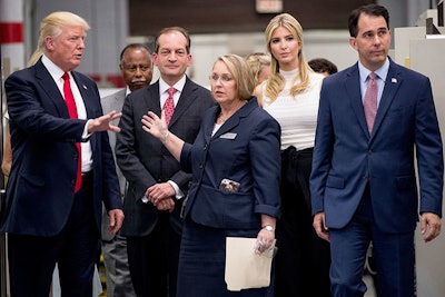 President Donald Trump, Labor Secretary Alexander Acosta, third from left, Ivanka Trump, the daughter of President Donald Trump, second from right, and Wisconsin Gov. Scott Walker, right, tour the Waukesha County Technical College in Pewaukee, Wis., Tuesday, June 13, 2017. (AP Photo/Andrew Harnik)