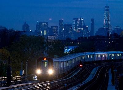 A No. 7 subway train rides the rails in the Queens borough of New York, with the Manhattan skyline in the background. On Monday, July 17, 2017, the Federal Reserve of New York releases its July survey of manufacturers in the state. (AP Photo/Mark Lennihan, File)
