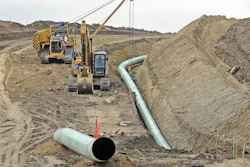 In this Oct. 5, 2016, file photo, heavy equipment works at a site where sections of the Dakota Access pipeline are being buried near the town of St. Anthony in Morton County, N.D. The Army Corps of Engineers says additional environmental review of the already-operating pipeline ordered by a judge in June 2017 is likely to take the rest of the year. (Tom Stromme/The Bismarck Tribune via AP, File)