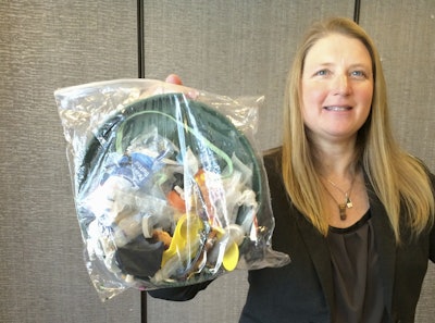 Jenna Jambeck, an environment engineering professor at the University of Georgia, holds a plastic baggie with trash collected from a clean up at Panama Beach, Fla., at the AAAS (American Association for the Advancement of Science) conference in San Jose, Calif. A new massive study finds that production of plastic and the hard-to-breakdown synthetic waste is soaring in huge numbers. The study says since 1950, industry has made more than 9 billion tons of plastics. That’s enough to cover the entire country of Argentina ankle deep in the stuff. (AP Photo/Seth Borenstein)
