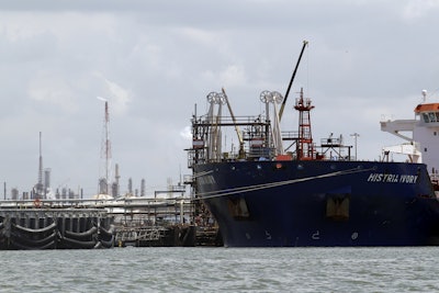 An oil tanker is docked at the Exxon Mobile Baytown complex along the Houston Ship Channel in Baytown, Texas. Federal lawsuits against the U.S. Environmental Protection Agency were filed claiming the agency has failed to correct Texas air pollution control permits with loopholes that make state enforcement rare. The suits filed Thursday, July 20, 2017, by the nonprofit Washington, D.C.-based Environmental Integrity Project, target permits for the largest integrated petrochemical factory in the U.S., three refineries near the Houston Ship Channel including the largest petroleum refinery in the U.S. and a coal-fired power plant east of Dallas. (AP Photo/David J. Phillip, File)