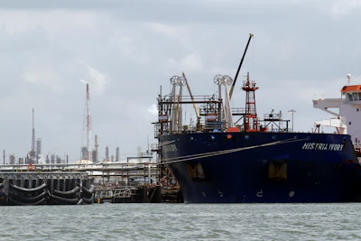 An oil tanker is docked at the Exxon Mobile Baytown complex along the Houston Ship Channel in Baytown, Texas. Federal lawsuits against the U.S. Environmental Protection Agency were filed claiming the agency has failed to correct Texas air pollution control permits with loopholes that make state enforcement rare. The suits filed Thursday, July 20, 2017, by the nonprofit Washington, D.C.-based Environmental Integrity Project, target permits for the largest integrated petrochemical factory in the U.S., three refineries near the Houston Ship Channel including the largest petroleum refinery in the U.S. and a coal-fired power plant east of Dallas. (AP Photo/David J. Phillip, File)