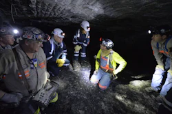 In this Jan. 13, 2015 file photo, Joe Main, third from left, Assistant Secretary of Labor for Mine Safety and Health, and Patricia Silvey, center, Deputy Assistant Secretary for Operations with MSHA, speak with workers at the Gibson North mine, in Princeton, Ind. Deaths in U.S. coal mines this year have surged ahead of last year’s, and federal safety officials say the inexperience of those new to a mine could share the blame. But the nation’s coal miner’s union says the mine safety agency isn’t taking the right approach to fixing the problem. Silvey said eight of the coal miners who died this year had less than a year’s experience at the mine where they worked. 'We found from the stats that category of miners were more prone to have an accident,” Silvey said in an interview with The Associated Press before the 10th death occurred at a mine in Pennsylvania on July 25. (AP Photo/Timothy D. Easley, File)