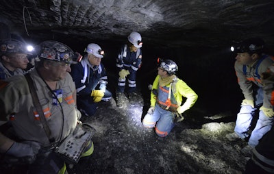 In this Jan. 13, 2015 file photo, Joe Main, third from left, Assistant Secretary of Labor for Mine Safety and Health, and Patricia Silvey, center, Deputy Assistant Secretary for Operations with MSHA, speak with workers at the Gibson North mine, in Princeton, Ind. Deaths in U.S. coal mines this year have surged ahead of last year’s, and federal safety officials say the inexperience of those new to a mine could share the blame. But the nation’s coal miner’s union says the mine safety agency isn’t taking the right approach to fixing the problem. Silvey said eight of the coal miners who died this year had less than a year’s experience at the mine where they worked. 'We found from the stats that category of miners were more prone to have an accident,” Silvey said in an interview with The Associated Press before the 10th death occurred at a mine in Pennsylvania on July 25. (AP Photo/Timothy D. Easley, File)
