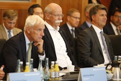 From right to left : Harald Krueger, CEO of German car maker BMW, Dieter Zetsche, chairman of German car maker Daimler AG and head of Mercedes-Benz cars and Matthias Mueller, CEO of German car maker Volkswagen have taken seat to attend a so-called diesel summit on Wednesday, Aug. 2, 2017 in Berlin. German government officials and automakers meet to discuss the future of diesel vehicles, after a nearly two-year saga of scandal spread from Volkswagen to others in the sector. (Axel Schmidt/Pool Photo via AP)