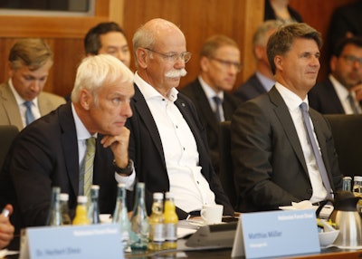From right to left : Harald Krueger, CEO of German car maker BMW, Dieter Zetsche, chairman of German car maker Daimler AG and head of Mercedes-Benz cars and Matthias Mueller, CEO of German car maker Volkswagen have taken seat to attend a so-called diesel summit on Wednesday, Aug. 2, 2017 in Berlin. German government officials and automakers meet to discuss the future of diesel vehicles, after a nearly two-year saga of scandal spread from Volkswagen to others in the sector. (Axel Schmidt/Pool Photo via AP)