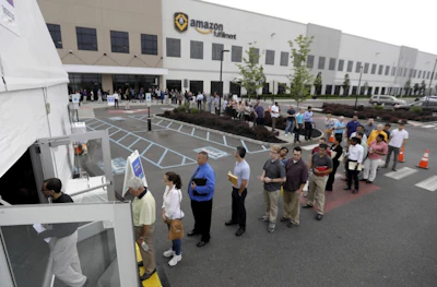 Job candidates outside the Amazon fulfillment center in Robbinsville, N.J. (AP photo)