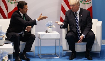 President Donald Trump meets with Mexican President Enrique Pena Nieto at the G20 Summit, Friday, July 7, 2017, in Hamburg. (AP Photo/Evan Vucci)