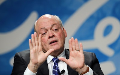 Ford Motor Co. CEO Jim Hackett speaks after being introduced as the automaker's new chief executive in Dearborn, Mich. Hackett says the company isn’t taking its eyes off the present as it prepares for transportation in the future. (AP Photo/Paul Sancya, File)