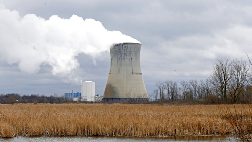 In this Tuesday, April 4, 2017, file photo, plumes of steam drift from the cooling tower of FirstEnergy Corp.'s Davis-Besse Nuclear Power Station in Oak Harbor, Ohio. Testimony submitted to Ohio lawmakers largely opposes a proposed special fee on FirstEnergy Corp.'s customers in the state, The Plain Dealer reported Thursday, June 8, 2017, though the Akron-based utility says the money is needed to secure the future of Ohio's two aging nuclear plants, the Davis-Besse Nuclear Power Station and the Perry Nuclear Power Plant. (AP Photo/Ron Schwane, File)