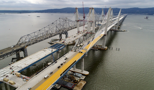 Construction continues on the spans of the new Governor Mario M. Cuomo Bridge, right, as vehicles make their way on the the Tappan Zee Bridge over the Hudson River, near Tarrytown, N.Y. President Donald Trump’s road to getting legislation through Congress this year to restore the nation’s crumbling infrastructure appears increasingly precarious. (AP Photo/Julie Jacobson, File)
