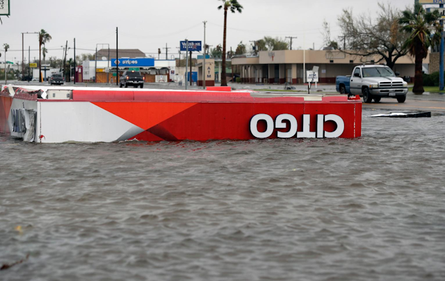 The roof of a gas station sits in flood waters in the wake of Hurricane Harvey, Saturday, Aug. 26, 2017, in Aransas Pass, Texas. Harvey rolled over the Texas Gulf Coast on Saturday, smashing homes and businesses and lashing the shore with wind and rain so intense that drivers were forced off the road because they could not see in front of them. (AP Photo/Eric Gay)
