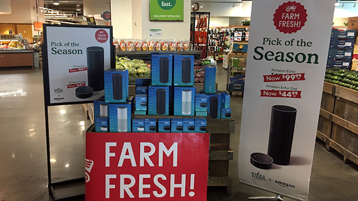 Amazon's Echo and Echo Dot appear on sale at a Whole Foods Market in New York, Monday, Aug. 28, 2017. Amazon has completed its $13.7 billion takeover of organic grocer Whole Foods, and the e-commerce giant is wasting no time putting its stamp on the company. Prices were lowered; Whole Foods brands will soon be on Amazon's site; and Amazon's Prime members could soon get discounts at Whole Foods. The deal could also spur changes in the wider grocery industry. (AP Photo/Joseph Pisani)