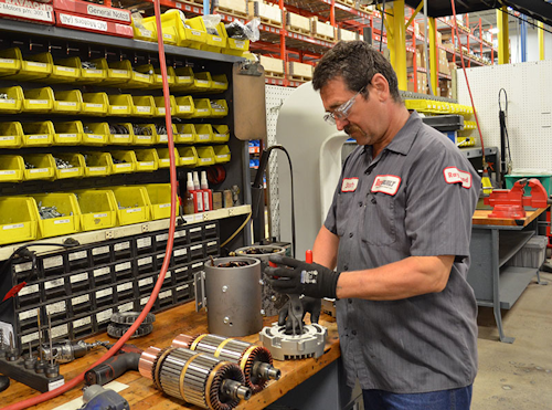 An employee works on a motor at the new RayBuilt Center of Excellence. (Raymond Photo)
