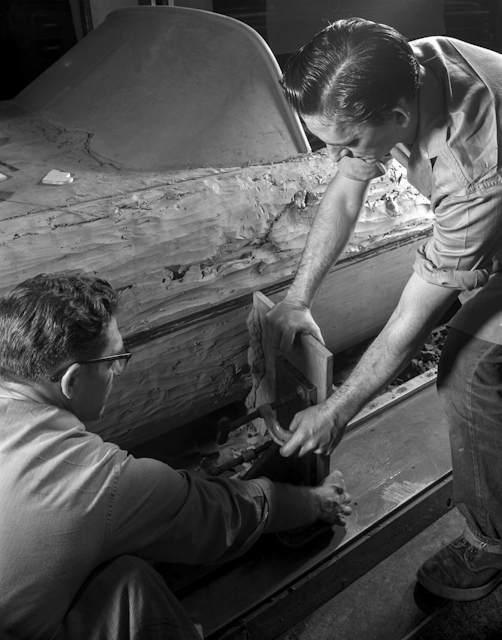 This 1954 photo Courtesy of General Motors shows Buick Design Studio creative clay sculptors as they mold the clay on a model GM automobile. (Courtesy of General Motors via AP)