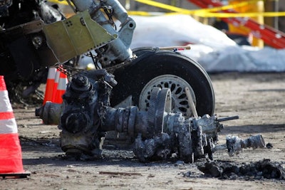 In this Feb. 16, 2009, file photo, debris at the scene of a plane crash site of Continental Connection Flight 3407 in Clarence Center, N.Y. (AP Photo/David Duprey, pool)